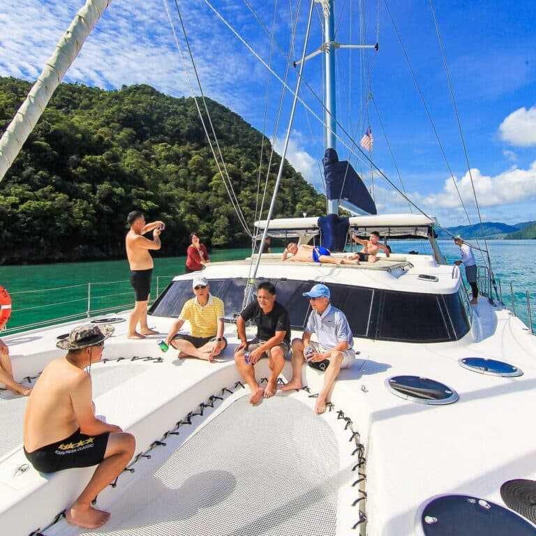 Tourists relaxing under the sun on Langkawi Premium Cruise
